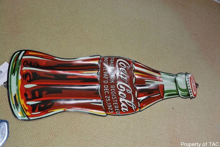 Coca-Cola Christmas Bottle" sign"