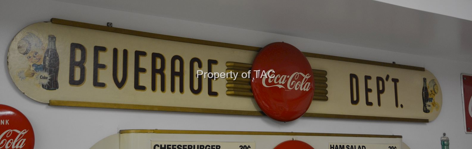 Coca-Cola button on a Kay Display back
