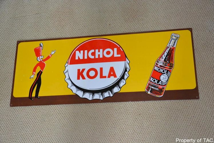 Nichol Kola w/bottle sign