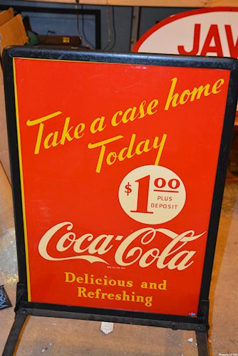 Coca-Cola Take a case home today" sign"