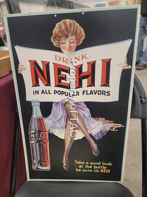 Drink Nehi "In all popular flavors" w/Lady Cardboard sign