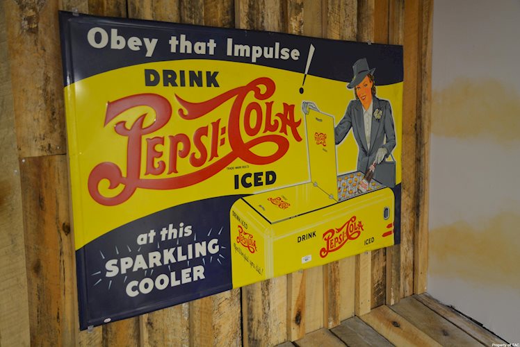 Drink Pepsi:Cola at this sparking cooler" sign"