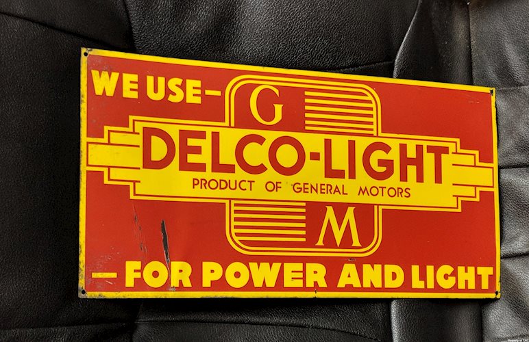 We Use GM General Motors Delco Light for Power and Light SST Single Sided Tin Sign