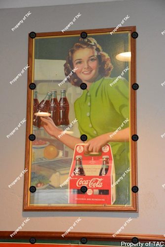 Coca-Cola poster w/lady carrying a six pack