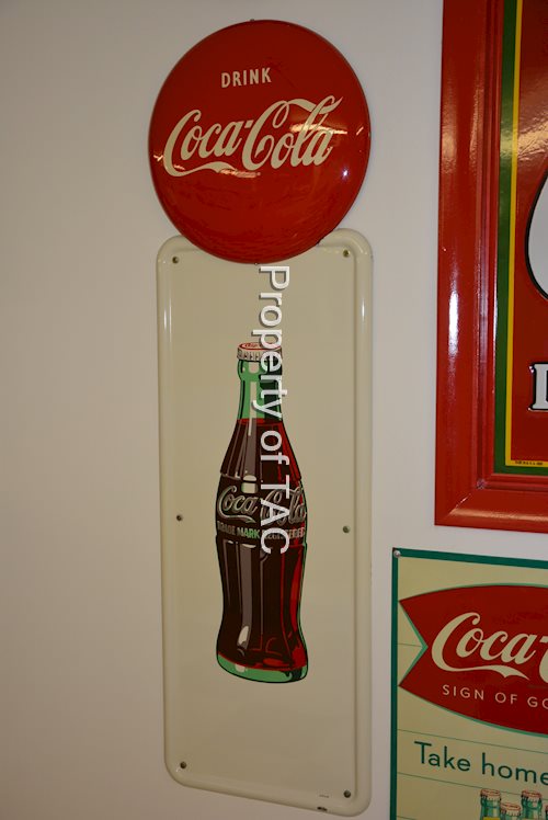 Drink Coca-Cola button on bottle pilaster
