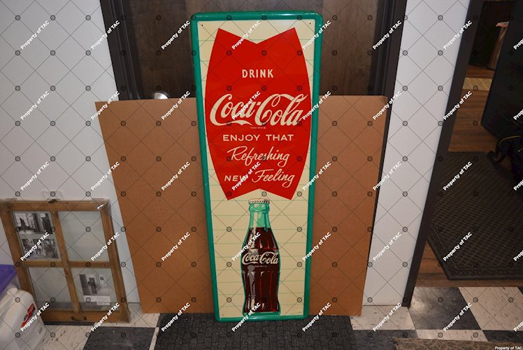 Drink Coca-Coca Enjoy that Refreshing New Feeling" sign"