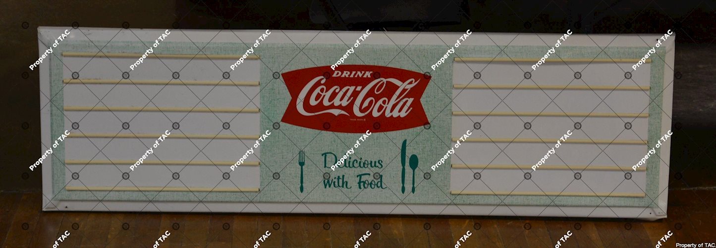 Drink Coca-Cola Delicious with Food" sign"