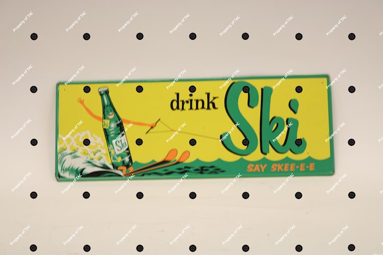 Drink Ski Say Shee-ee" w/bottle skiing logo sign"