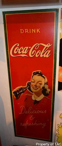 Drink Coca-Cola Delicious & Refreshing" sign"