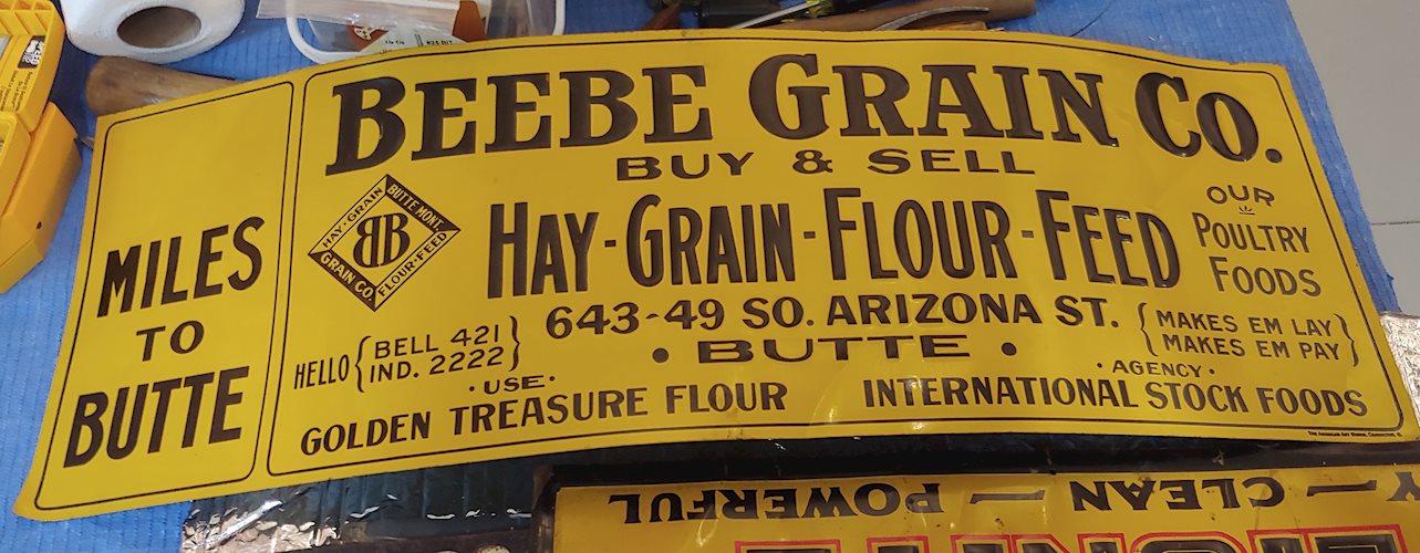 Beebe Grain Co. Miles to Butte Metal Tacker Sign