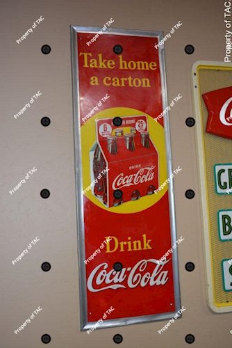 Drink Coca-Cola Take Home a Carton" sign"