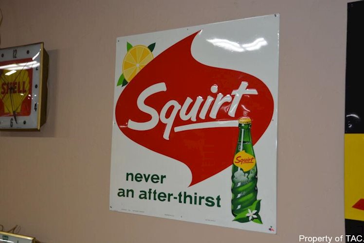 Squirt never an after-thirst" w/bottle sign"
