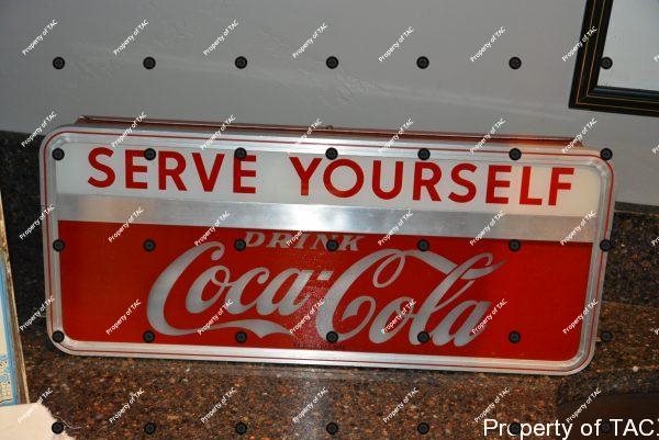 Coca-Cola Serve Yourself" lighted sign"