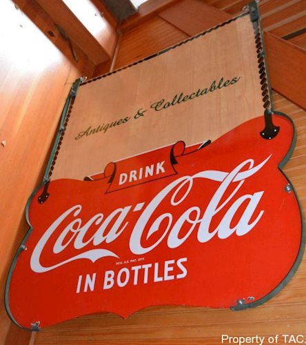 Drink Coca-Cola in bottles sign