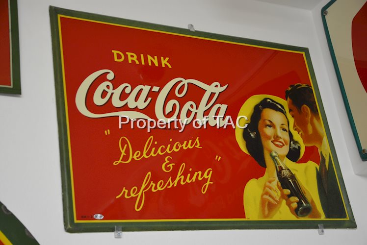 Drink Coca-Cola "Delicious & refreshing" with couple holding bottle