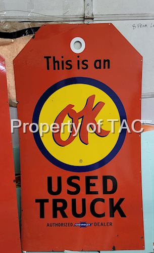 This is an OK Used Truck Porcelain Sign (tag shaped)