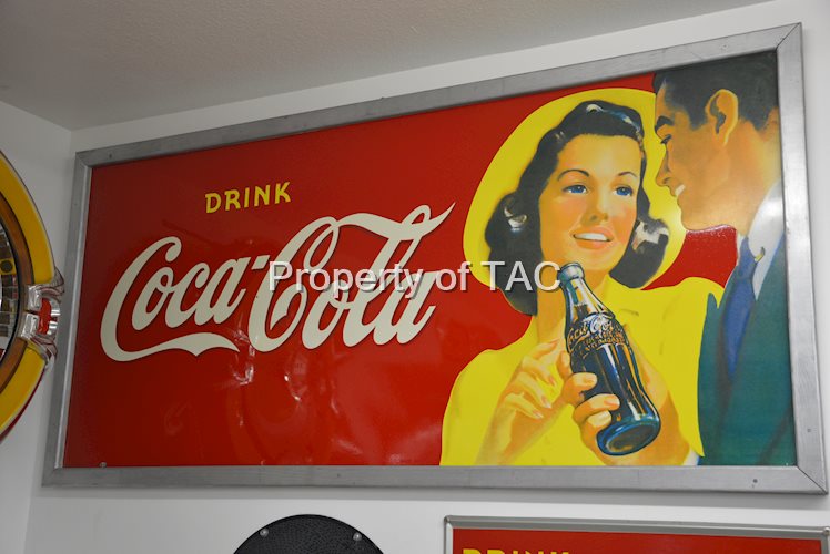 Drink Coca-Cola "Delicious & refreshing" with couple holding bottle
